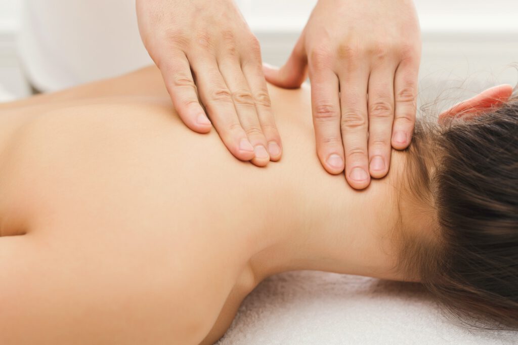 Woman getting classical back and neck massage